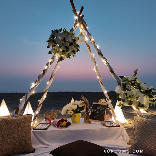 luxury candle light dinner in triangular setup package goa
